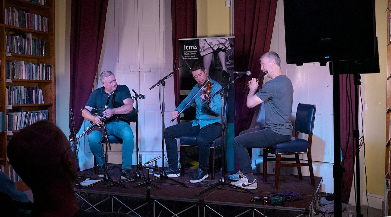 Three traditional Irish musicians performing