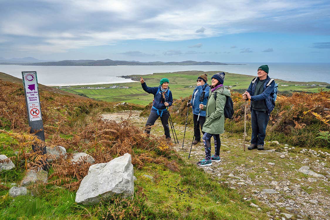 Solas Ireland Walks and Hikes guided group on a path overlooking the water