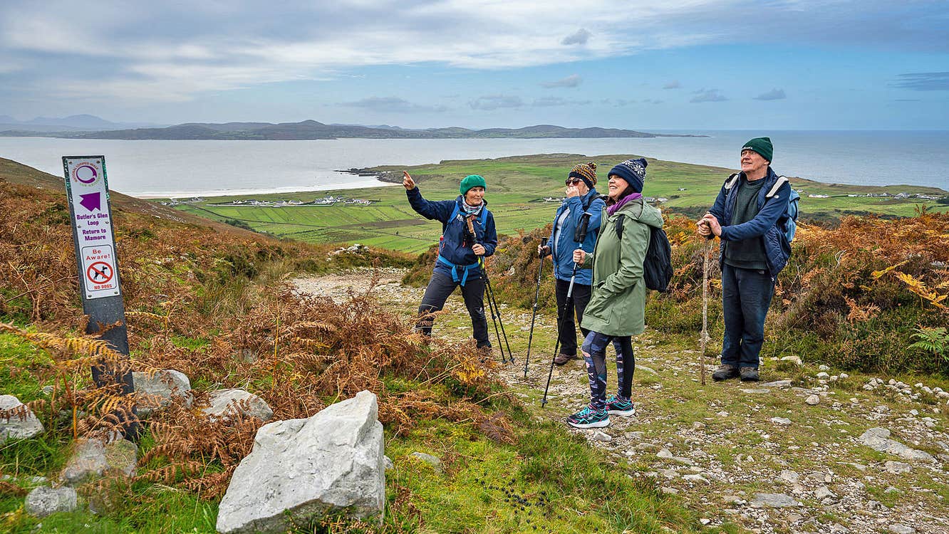 Solas Ireland Walks and Hikes guided group on a path overlooking the water