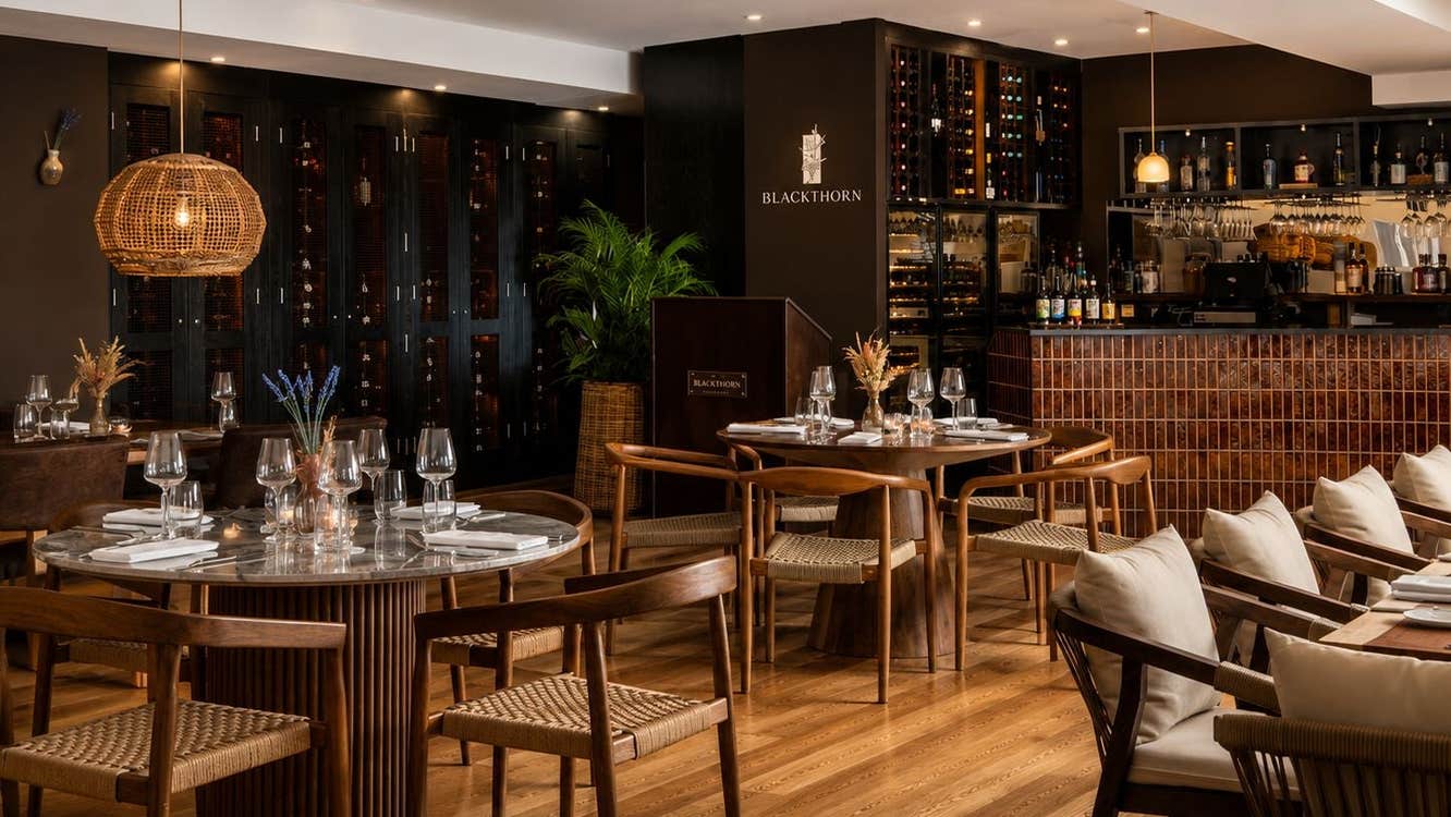 Dining room of a restaurant with chairs and tables set for service