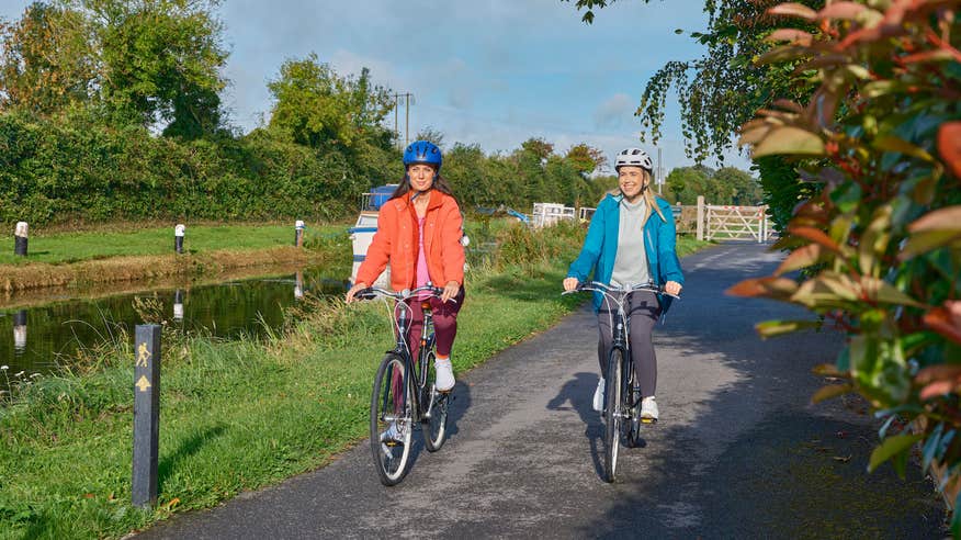 Two women cycling the Royal Canal Greenway