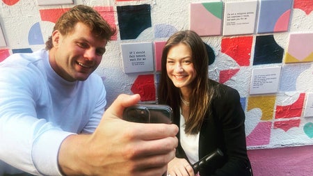 Taking a photograph while enjoying a modern and contemporary public art tour with Artful Tours