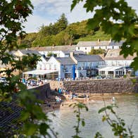 People getting into the water by the Strand Inn in Dunmore East, County Waterford.