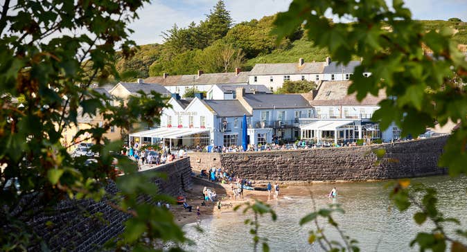 People getting into the water by the Strand Inn in Dunmore East, County Waterford.