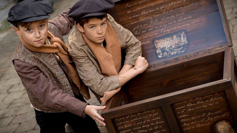 Two young actors dressed in character playing the Saul brothers at the Kilkenny Famine Experience