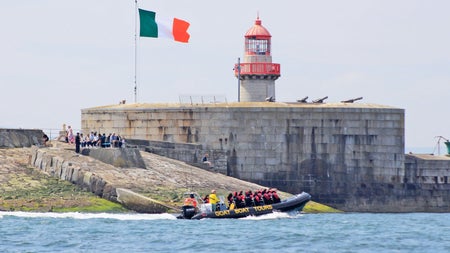 Goat Boat Tours group on a boat passing the East Pier Lighthouse in Dun Laoghaire