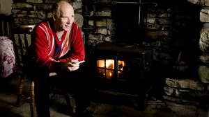 Image of farmer by fireside