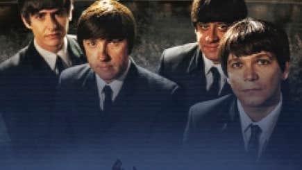 4 men in suits and ties and beatle hair cuts