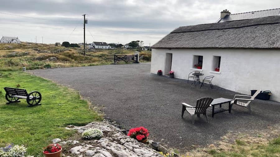 Exterior of the cottage with countryside view.