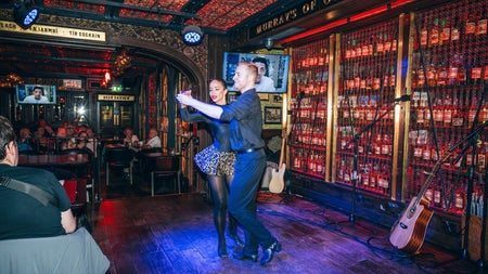 Guests enjoying traditional Irish dancing and live entertainment in Murray's Bar & Grill
