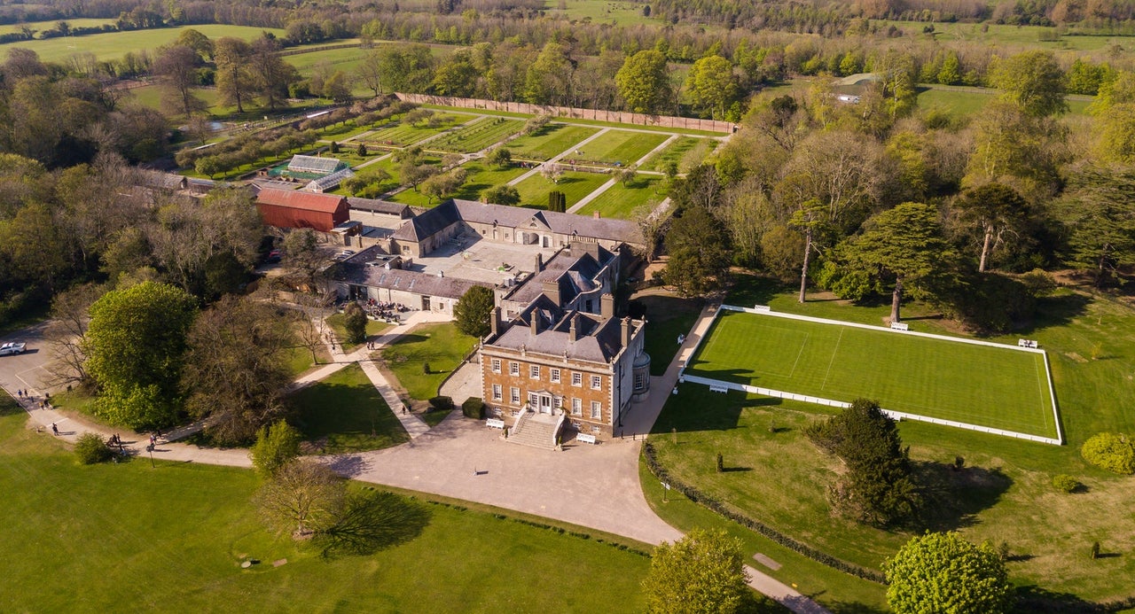 Aerial view of a large Georgian house on a large estate