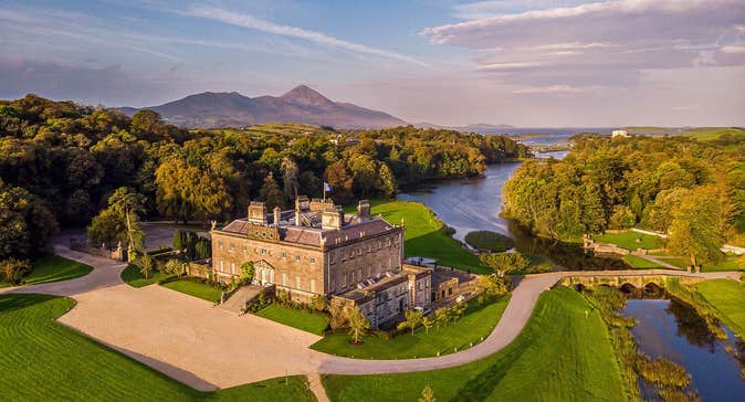 An aerial view of a large period house with an extensive garden