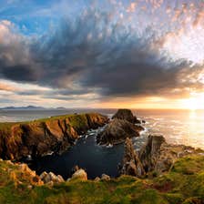 A sunset behind rocks at Malin Head in Donegal