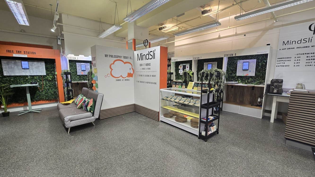Interior of a room with seating area and a display counter with wellness products