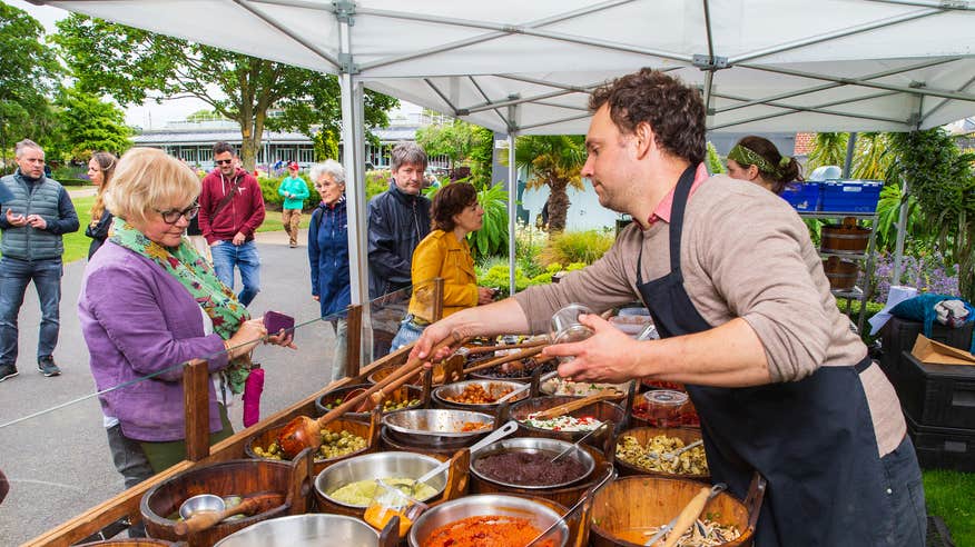 A vendor serving a customer at the People's Park Market in Dún Laoghaire, Co Dublin