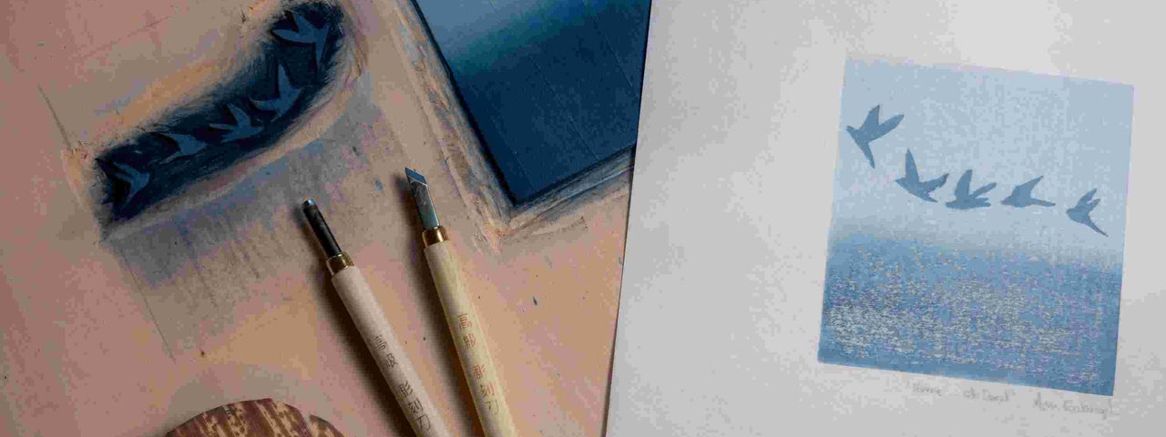 Mokuhanga Japanese Woodblock Printing with Ann Kavanagh, looking down on a table with print instruments and a finished art work.