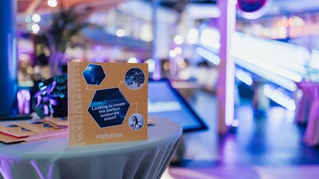A brightly lit area with a display advertising Explorium