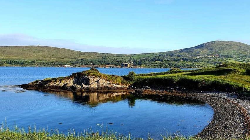 View of water and mountain at Berehaven Golf Club