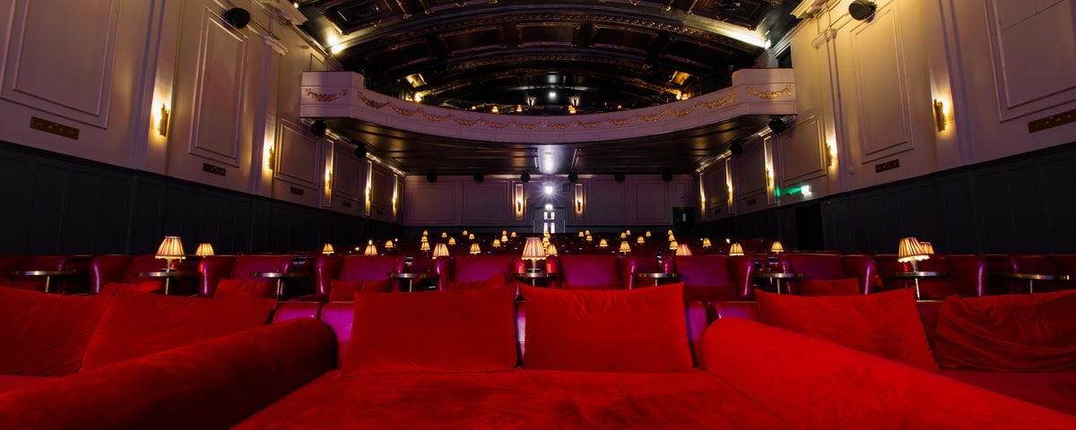 A view of plush seating in a restored old cinema