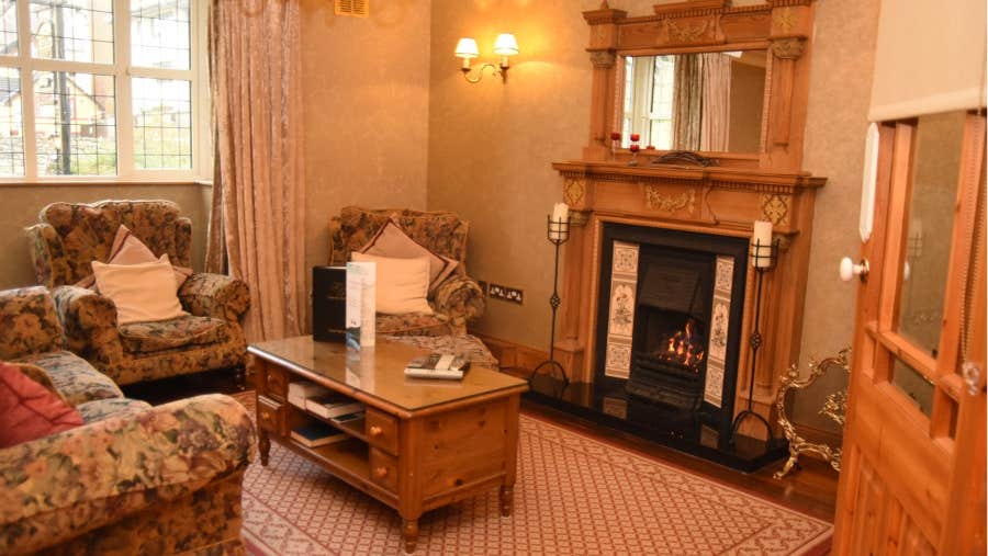 Sitting room with fireplace and seats