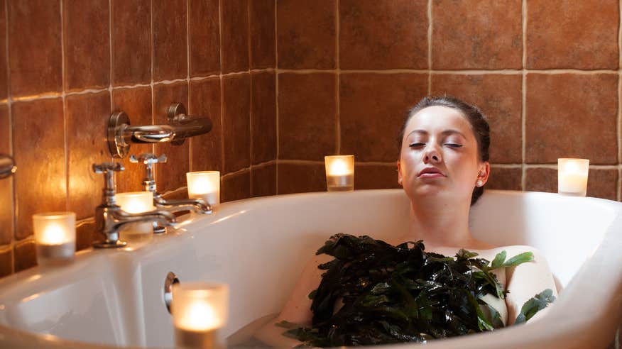 A woman in a seaweed bath at VOYA Seaweed Baths in Strandhill, County Sligo