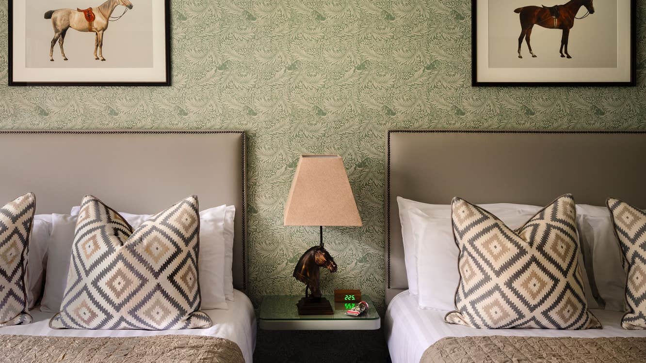 Twin bedroom with white and cream sheets