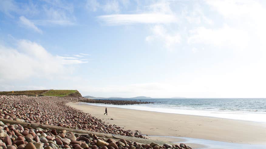 A person on Mulranny Beach in County Mayo