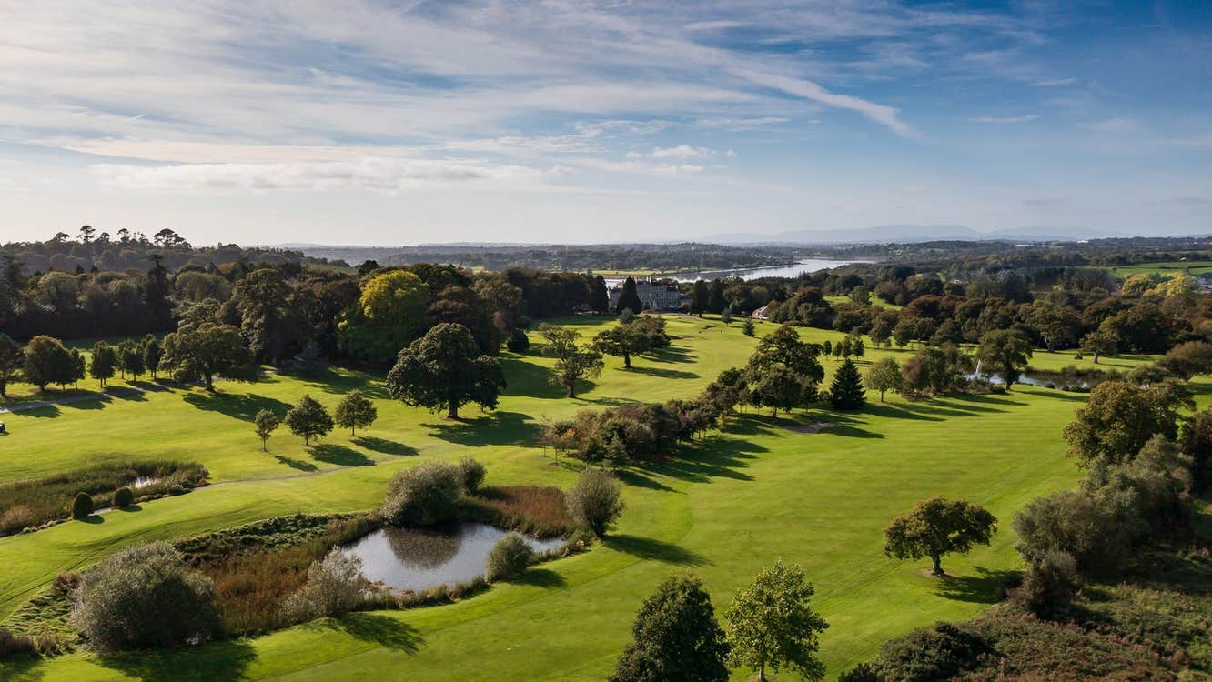 Aerial view of golf course dotted with trees