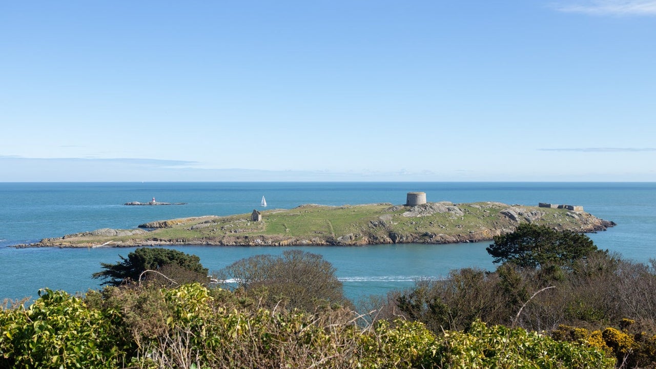 A view of a small island with a short tower