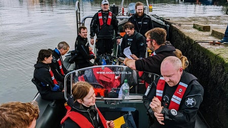 Crew on the dive boat at the pier preparing to go on a dive trip