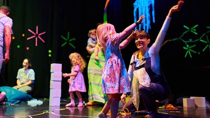 Children and adults playing or moving together