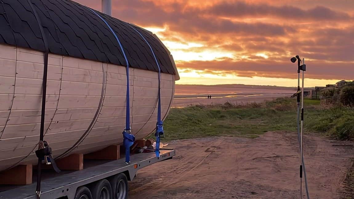 A sauna on the beach at sunset