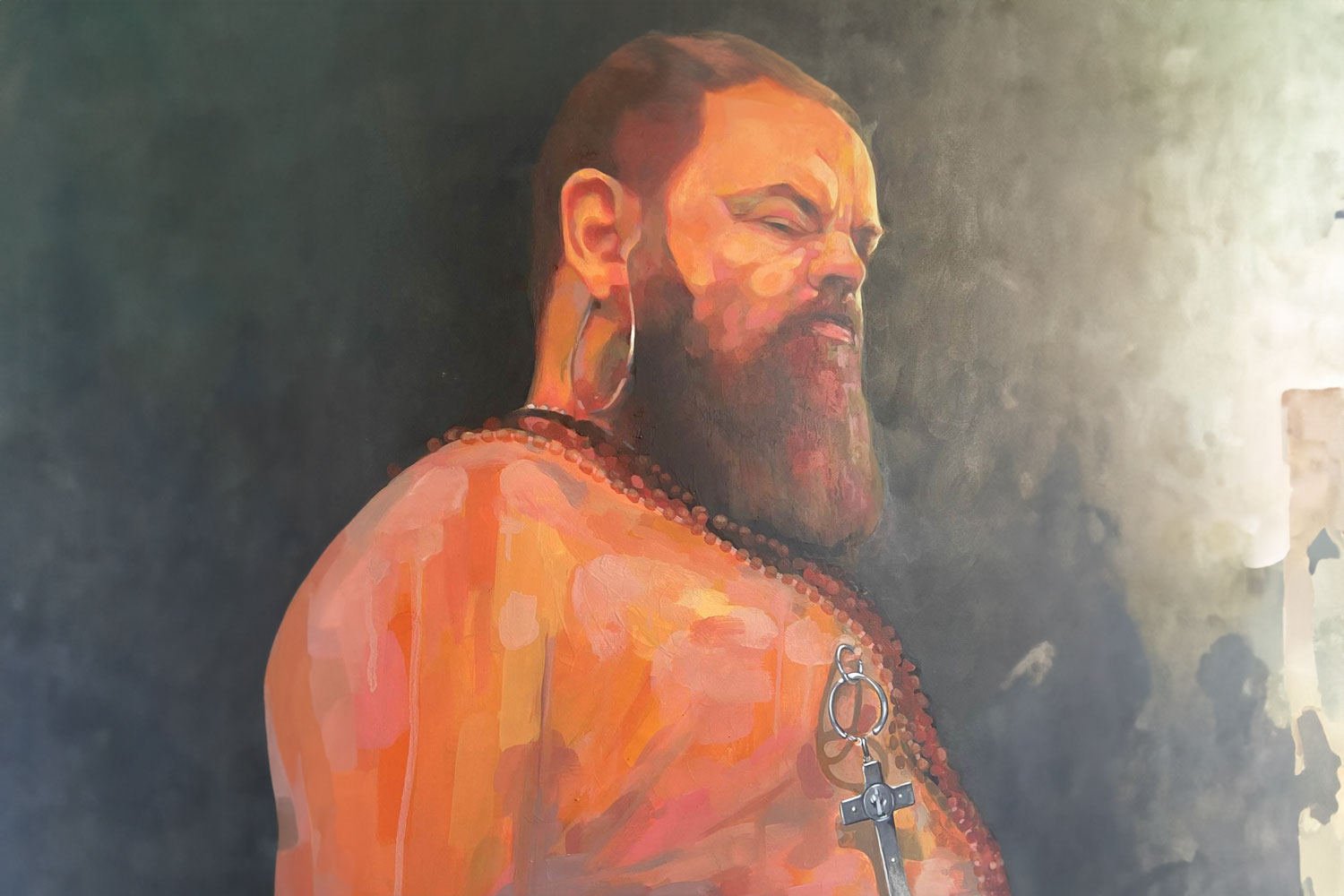 Painting of man's head and upper body viewed slightly from below and to his right side, he is looking downwards out of the corner of his eye, unclothed with necklaces and jewellery and a big beard.