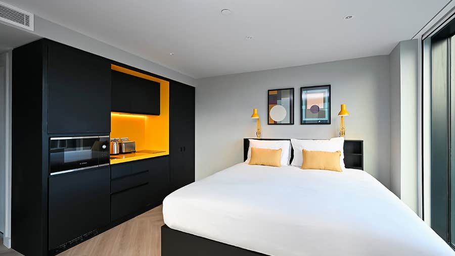 Apartment with bed and kitchenette