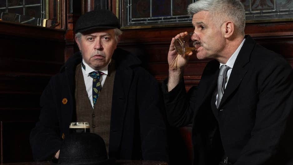 Counterparts & A Little Cloud - 2 men in old fashioned dark suits and ties drinking at a small table in a pub