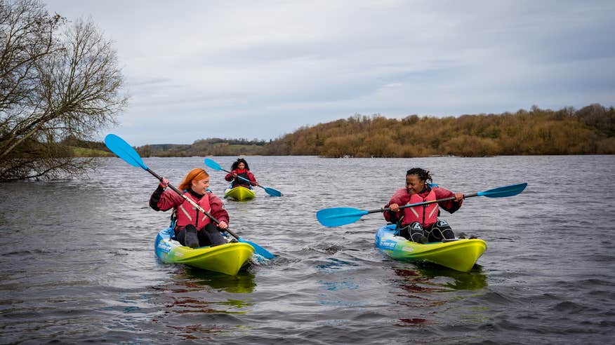 Three people kayaking in Cavan with Cavan Adventure Centre