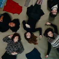 people lying on the floor in a random way, viewed from above looking down at them