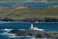 Landscape view of Valentia Island Lighthouse with the sea in the background