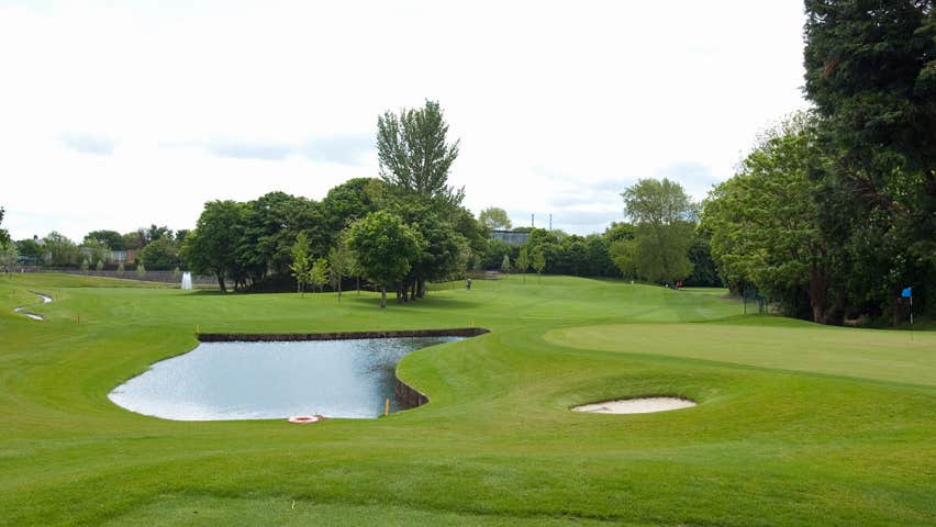 View of 13th and 14th fairways with pond in the centre and small bunker to the right