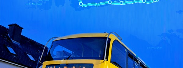 A bus drives through Galway, the route map highlighted on the sky behind it.