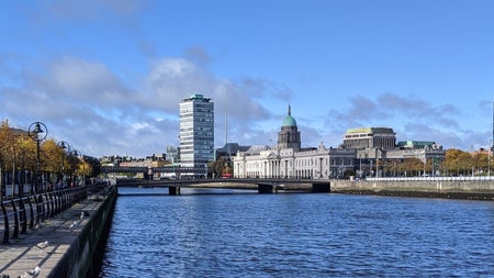 View of Dublin's custom house with quays on either side and a river to the forefront
