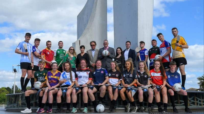 A large group of team players in various coloured team jerseys.