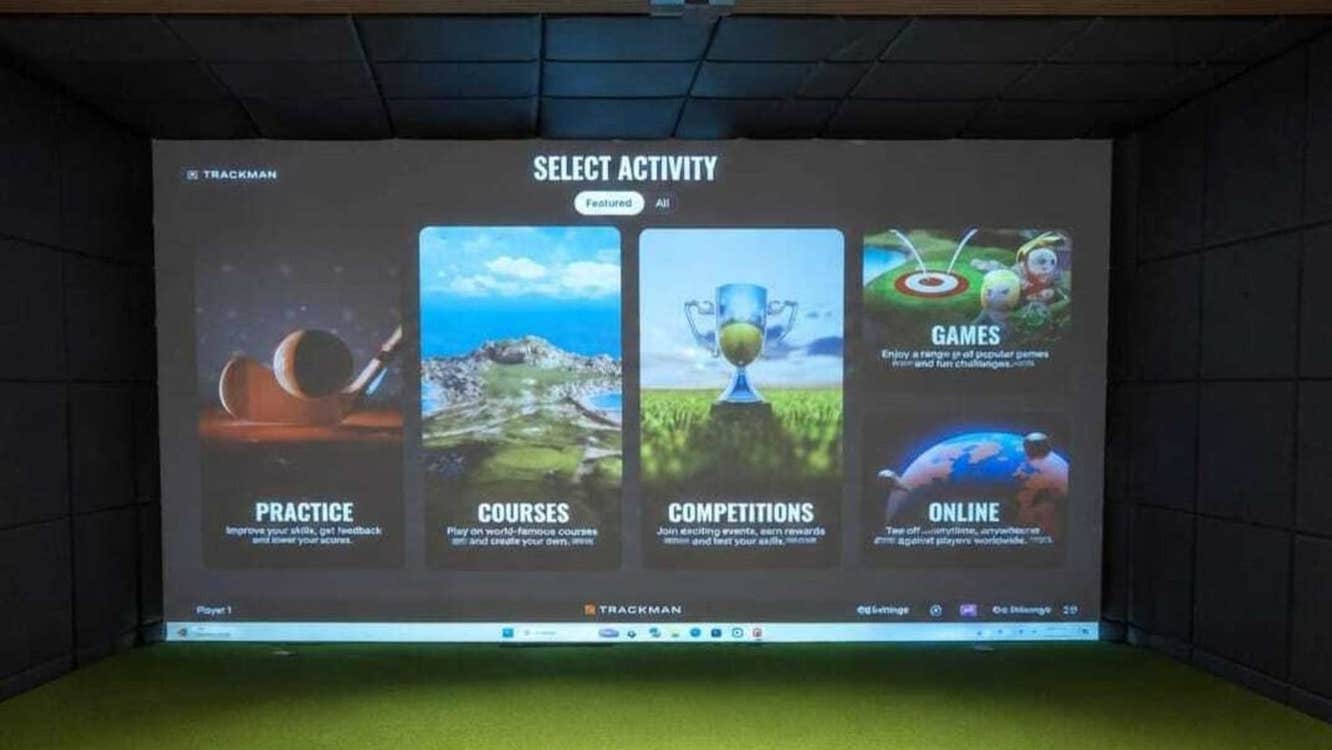 A large screen with golfing options on display