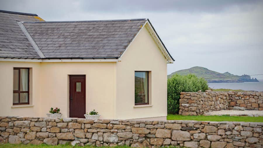 Front view of yellow house overlooking the sea