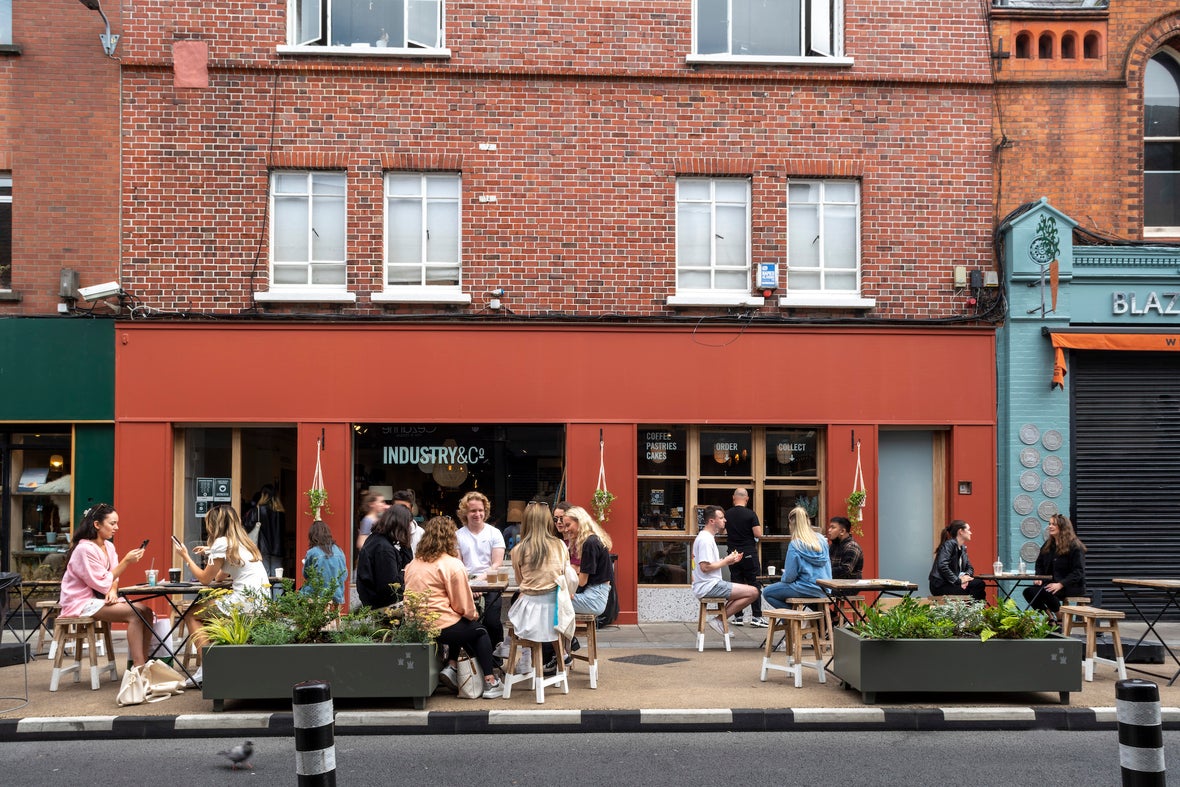 People sitting outside of a café on Drury Street in Dublin City