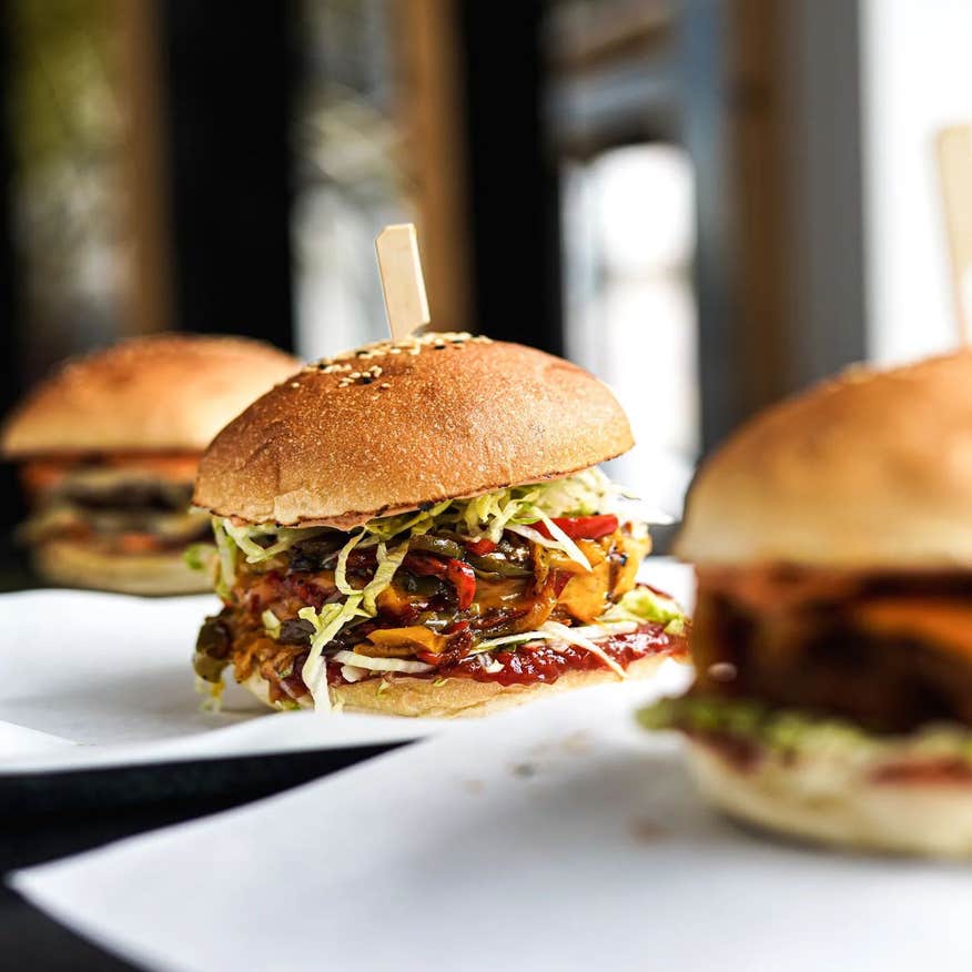 Three burgers on separate dishes at Flipside in County Sligo