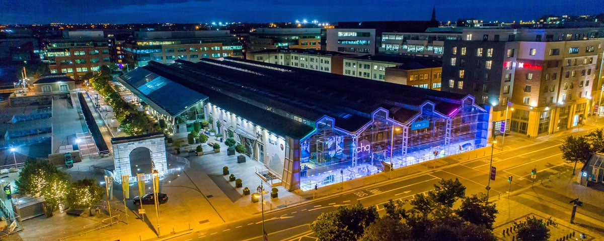 Image of CHQ building at night time with blue lighting