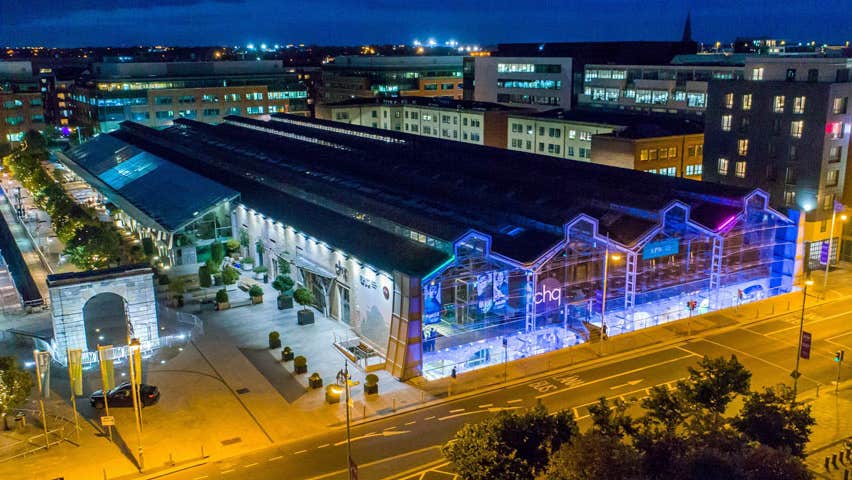 Image of CHQ building at night time with blue lighting