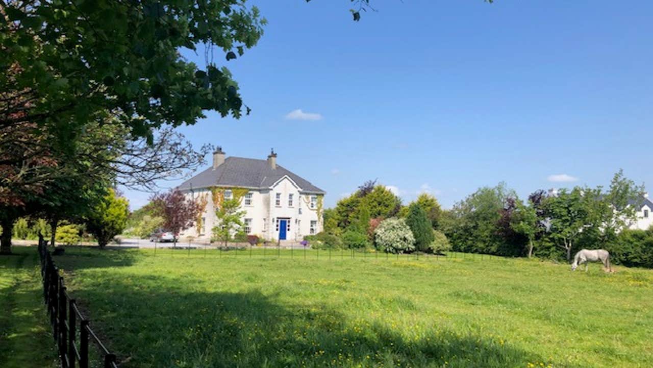 Front view of house and field