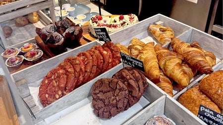 Trays on a counter with lots of colourful sweet treats